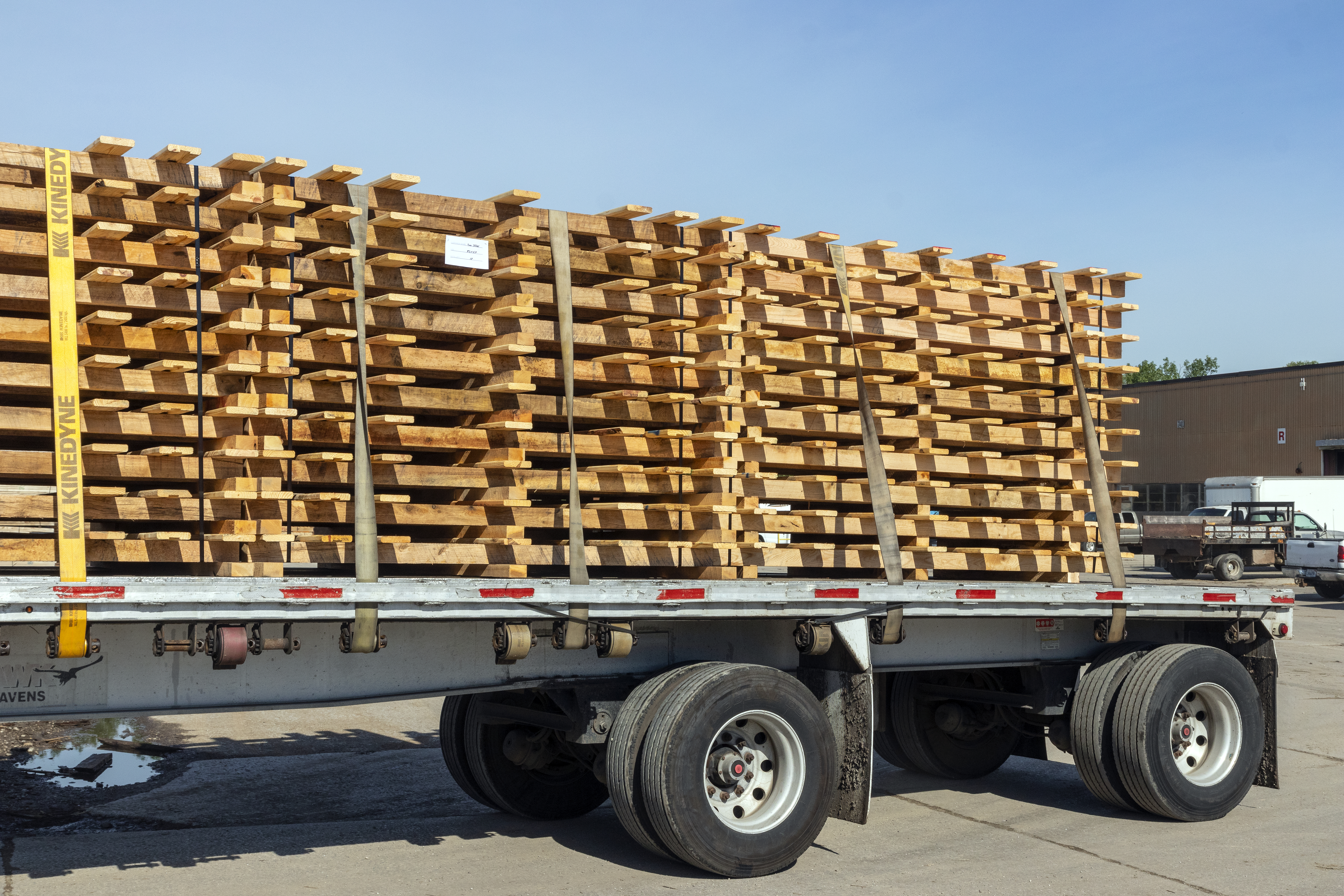 truck carrying load of skids